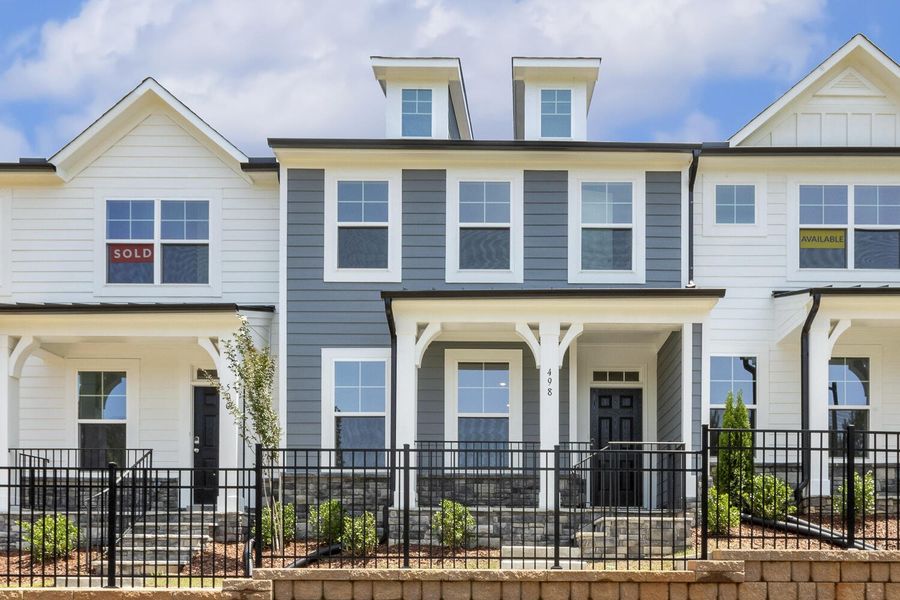 Front exterior of a new home in Enclave at Traditions Townhomes, Wake Forest, NC, highlighting curb appeal (Image 1).