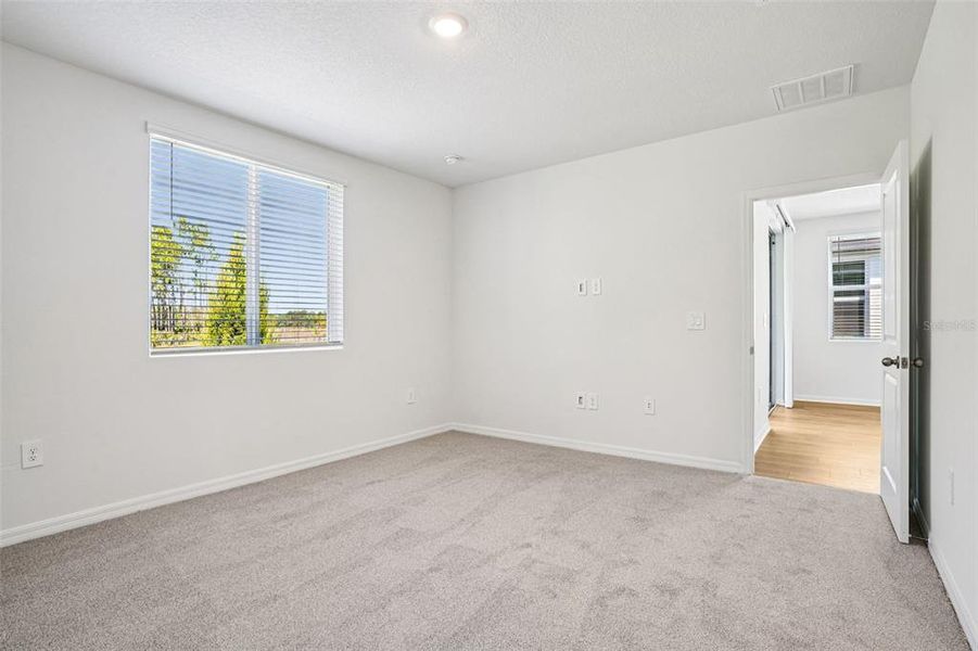 Spacious, unfurnished interior of a new home in Ridgehaven - Villas, Ormond Beach (Image 28).