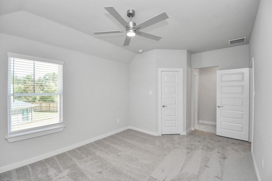 Generously sized secondary bedrooms featuring spacious closets, soft and inviting carpeting underfoot, large windows allowing plenty of natural light, and the added touch of privacy blinds for your personal retreat. Sample photo of completed home with similar floor plan. Actual colors and selections may vary. Generously sized secondary bedrooms featuring spacious closets, soft and inviting carpeting underfoot, large windows allowing plenty of natural light, and the added touch of privacy blinds for your personal retreat. Sample photo of completed home with similar floor plan. Actual colors and selections may vary.