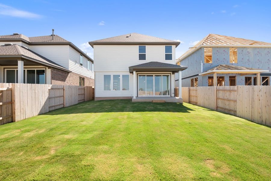 Exterior details and patio area of a home in Terrace Collection at Lariat, Liberty Hill (Image 24).