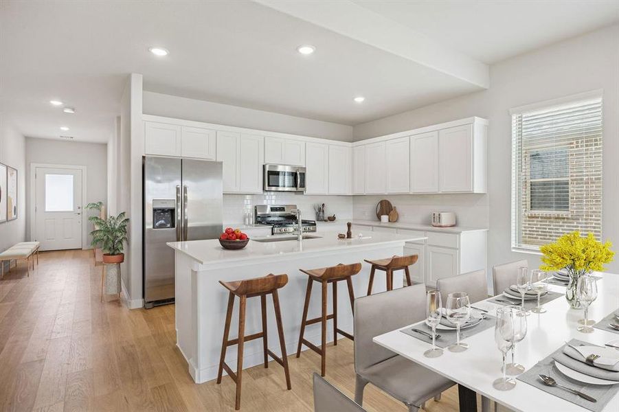 Kitchen in the Stanley II home plan by Trophy Signature Homes – REPRESENTATIVE PHOTO