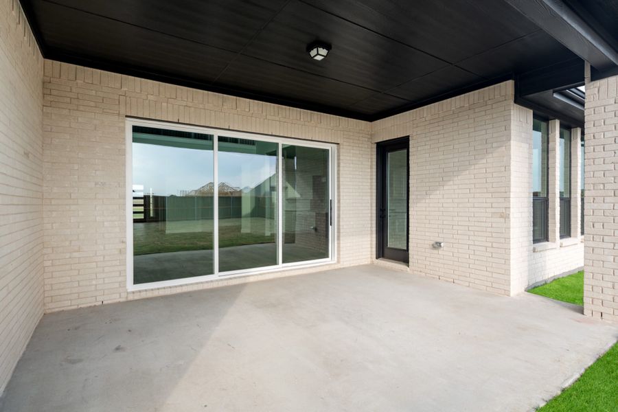 Exterior details and patio area of a home in Cambridge Crossing, Celina (Image 3).