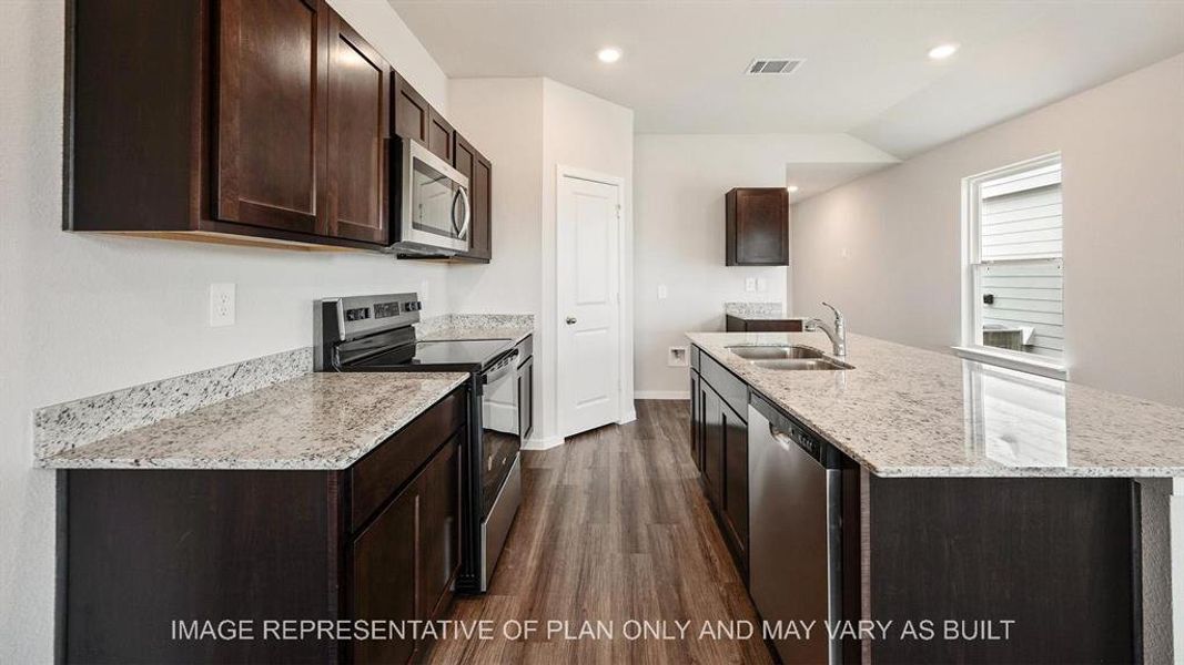 Furnished interior view inside a new home in Midtown Reserve, College Station (Image 1).