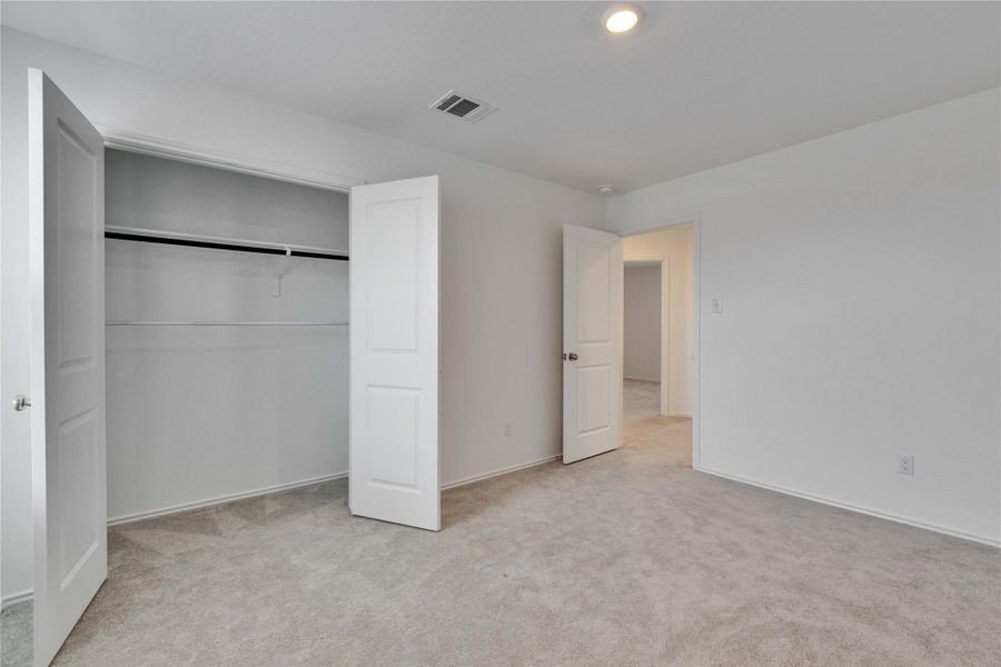 Upstairs bedroom with a walk in closet. Upstairs bedroom with a walk in closet.