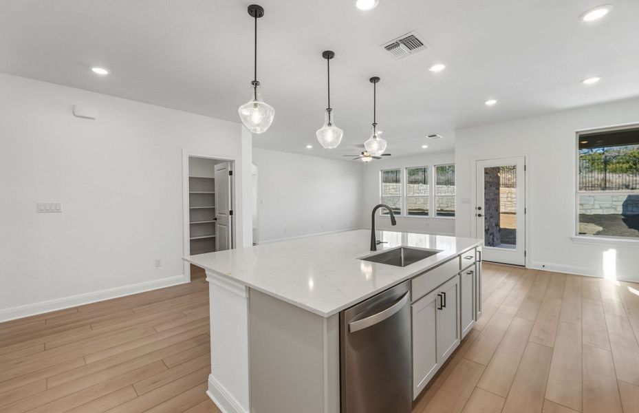Furnished interior view inside a new home in West Cypress Hills, Spicewood (Image 12).