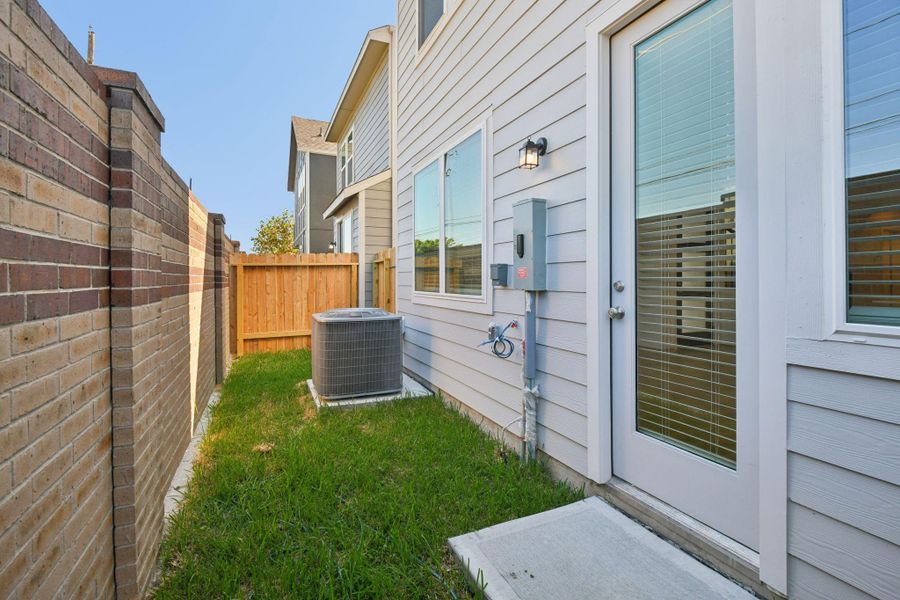 Exterior details and patio area of a home in Spring Brook Village - City Series, Houston (Image 2).