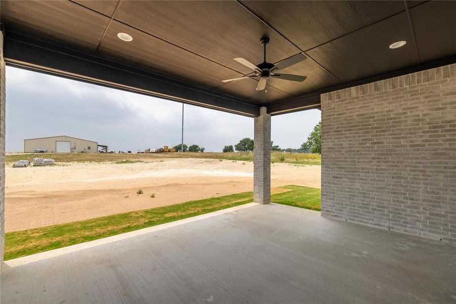 View of patio featuring ceiling fan