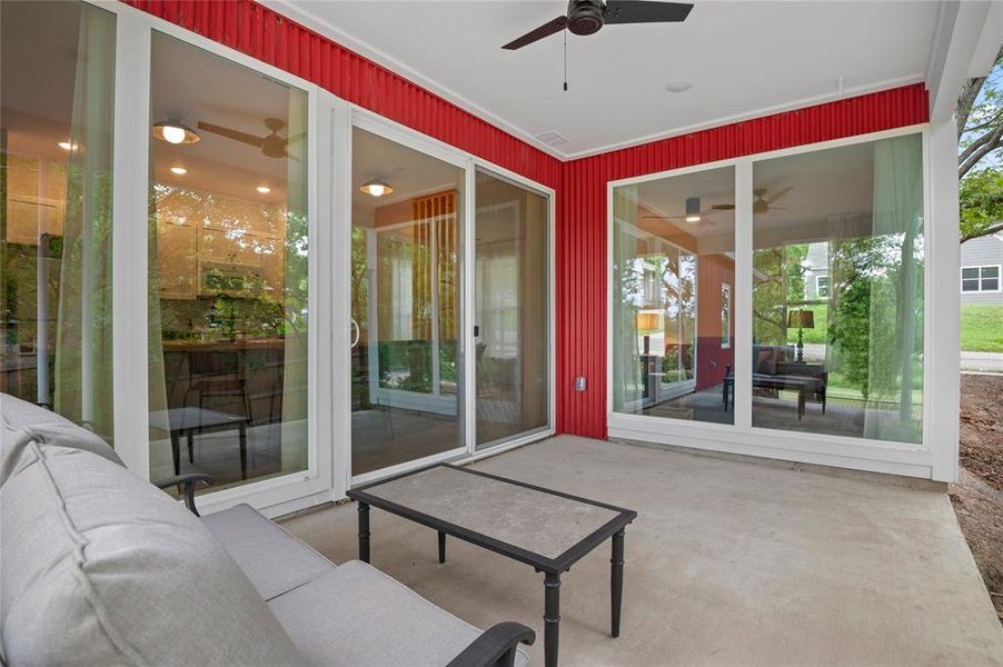 Covered patio to enjoy the outdoor space with ceiling fan.