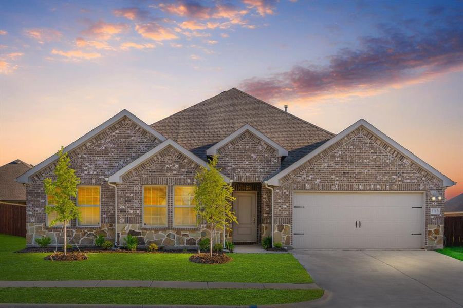 Front exterior of a new home in Fireside by the Lake, Garland, TX, highlighting curb appeal (Image 1). Front exterior of a new home in Fireside by the Lake, Garland, TX, highlighting curb appeal (Image 1).