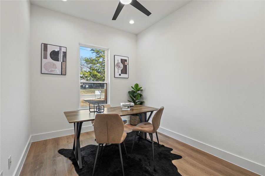 Dining space featuring light wood finished floors, ceiling fan, and recessed lighting