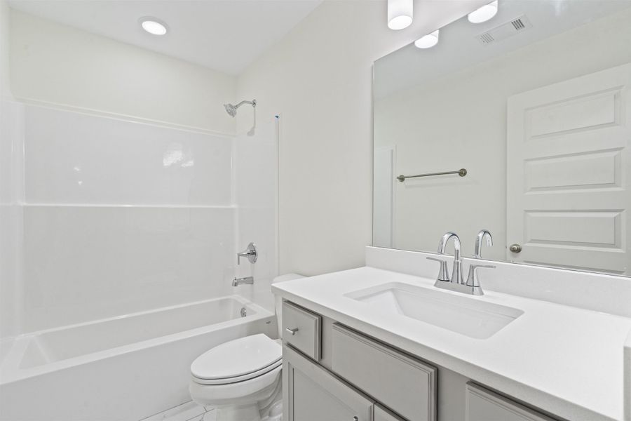Full bathroom featuring vanity and shower / tub combination