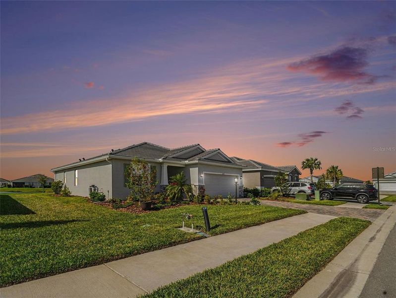 Front exterior of a new home in Star Farms at Lakewood Ranch, Bradenton, FL, highlighting curb appeal (Image 21).