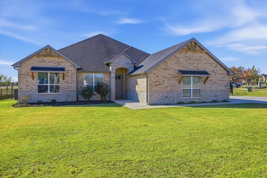 Front exterior of a new home in , Granbury, TX, highlighting curb appeal (Image 23).