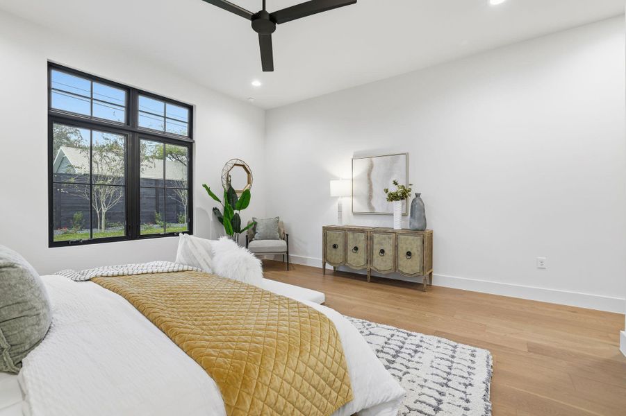 Bedroom featuring wood finished floors, recessed lighting, and ceiling fan