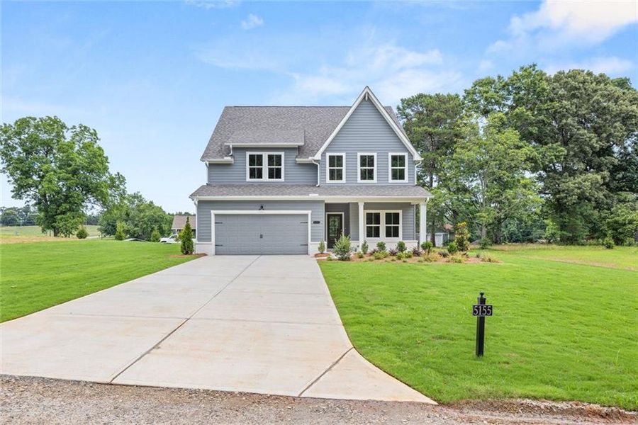 Front exterior of a new home in , Cumming, GA, highlighting curb appeal (Image 2). Front exterior of a new home in , Cumming, GA, highlighting curb appeal (Image 2).