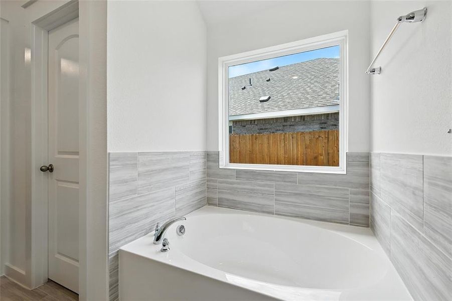 Bathroom featuring a garden tub Bathroom featuring a garden tub