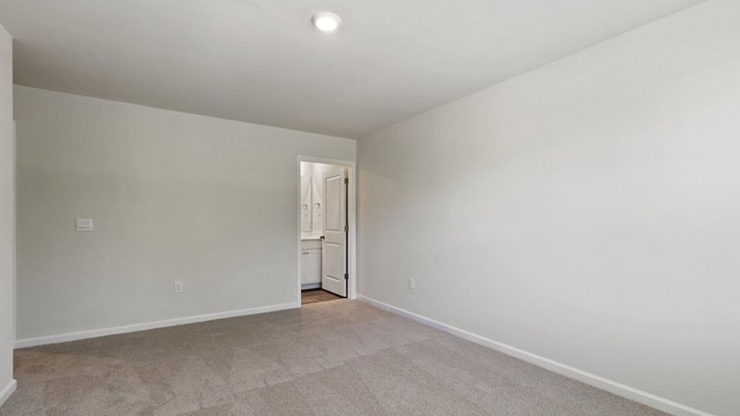 Spacious, unfurnished interior of a new home in Edinborough Townes, Gibsonville (Image 13).