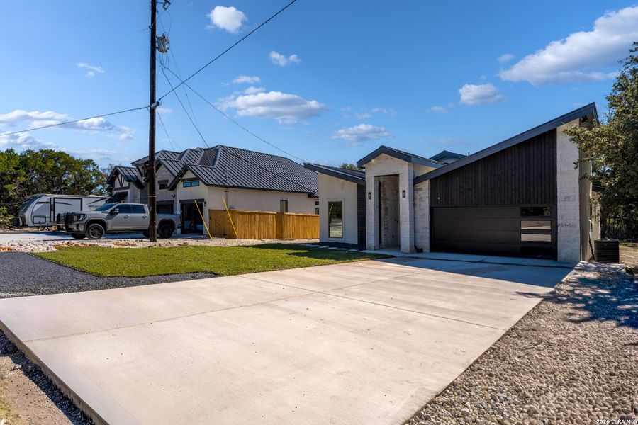 Front exterior of a new home in , Spring Branch, TX, highlighting curb appeal (Image 1). Front exterior of a new home in , Spring Branch, TX, highlighting curb appeal (Image 1).