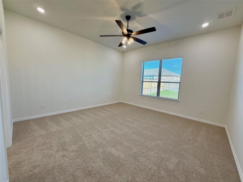 Unfurnished room featuring light carpet, recessed lighting, and a ceiling fan