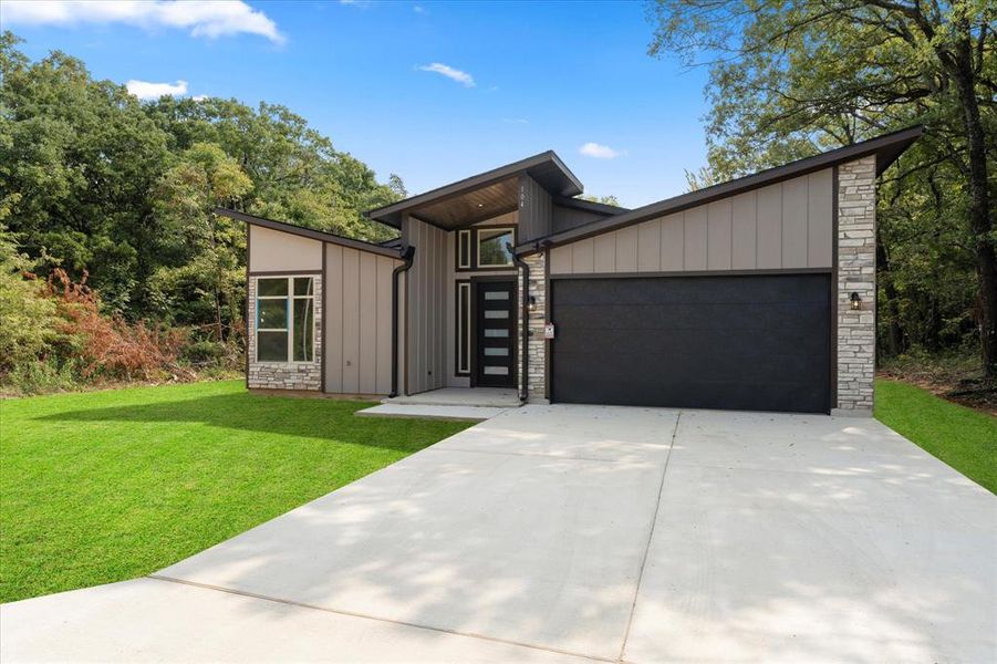 Front exterior of a new home in , Gun Barrel City, TX, highlighting curb appeal (Image 1). Front exterior of a new home in , Gun Barrel City, TX, highlighting curb appeal (Image 1).