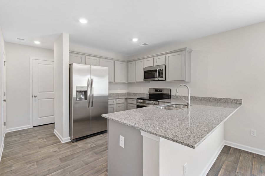 Representative furnished interior of a home built from the Poplar B by McGuinn Homes in Reserve at Mill Creek, Columbia (Image 17).