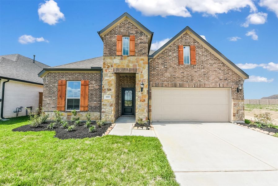 Front exterior of a new home in River Ranch Meadows, Dayton, TX, highlighting curb appeal (Image 23).