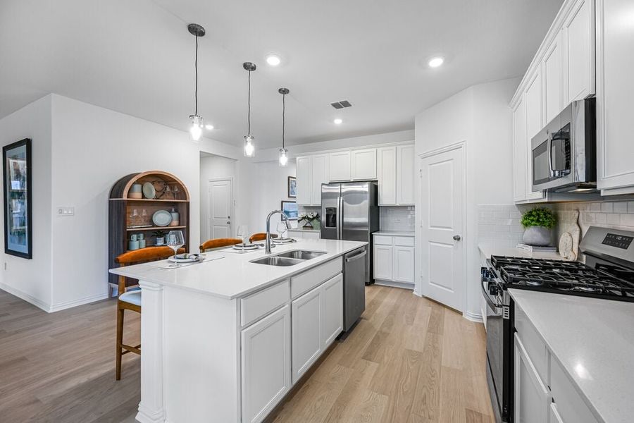 Representative furnished interior of a home built from the Georgetown by Taylor Morrison in River Ridge, Crandall (Image 5).