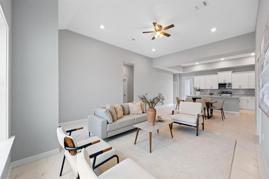 Spacious open-concept layout with high ceilings and tile flooring throughout—no carpet!