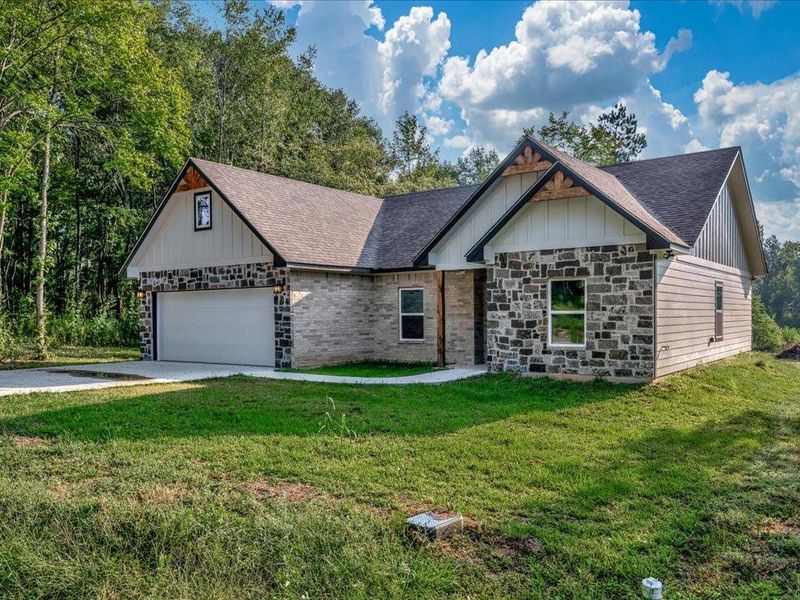 Front exterior of a new home in , Lufkin, TX, highlighting curb appeal (Image 19).