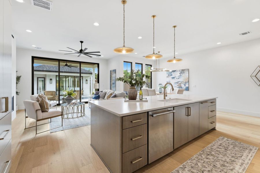 View from open kitchen to living and dining