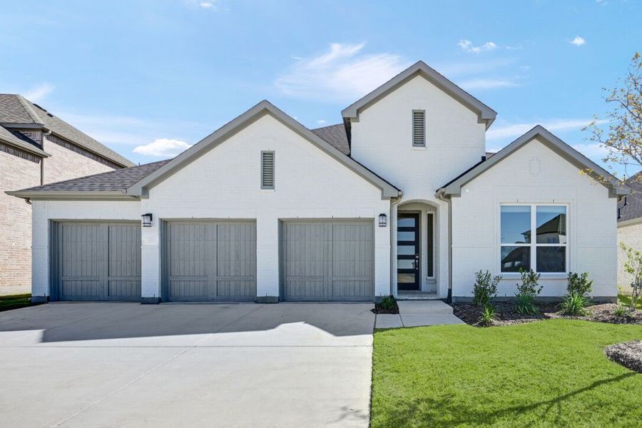 Representative exterior photo of a completed home built from the Garnet by Taylor Morrison in South Oak 60s, Oak Point, TX (Image 1).