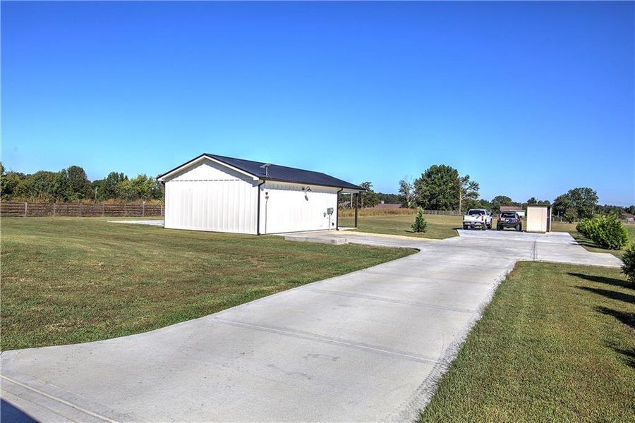 Front exterior of a new home in , Calhoun, GA, highlighting curb appeal (Image 27).