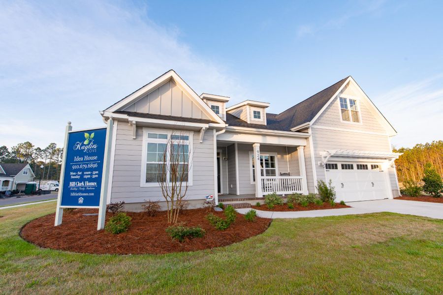 Representative exterior photo of a completed home built from the Helmsley by Bill Clark Homes in The Sanctuary at Sunset Beach, Sunset Beach, NC (Image 25). Representative exterior photo of a completed home built from the Helmsley by Bill Clark Homes in The Sanctuary at Sunset Beach, Sunset Beach, NC (Image 25).