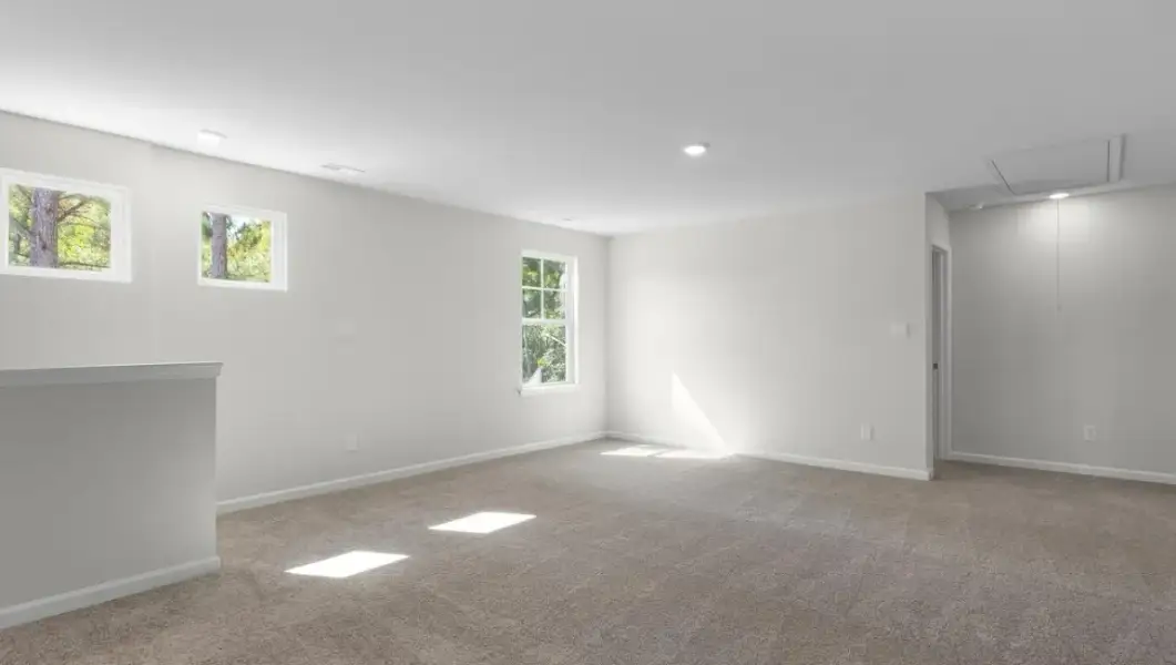 Spacious, unfurnished interior of a new home in The Highlands at Cedar Hill Landing, Navassa (Image 24).