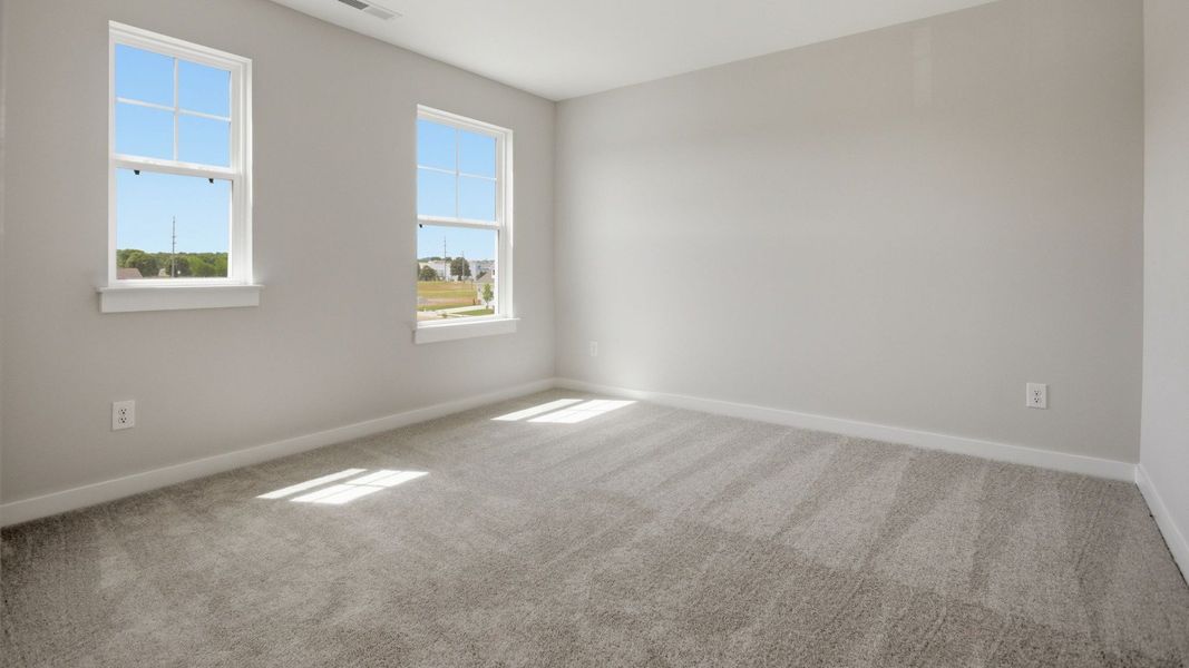 Bedroom with carpet and windows Bedroom with carpet and windows