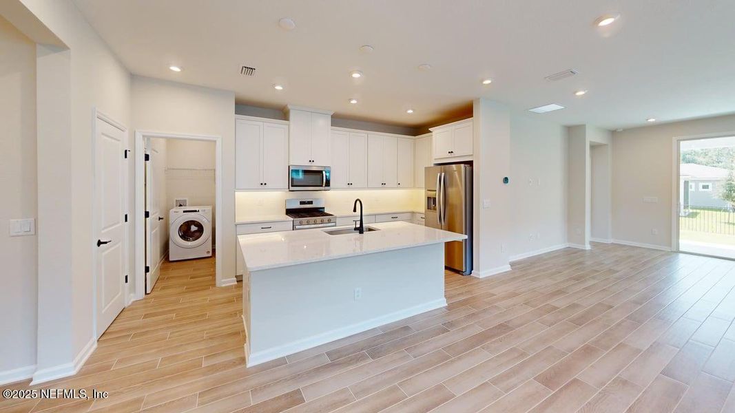 Furnished interior view inside a new home in RiverTown - WaterSong, St. Johns (Image 7). Furnished interior view inside a new home in RiverTown - WaterSong, St. Johns (Image 7).