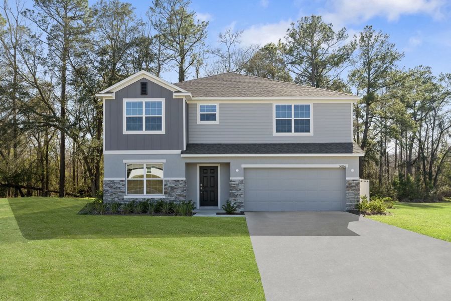 Front exterior of a new home in Deland, Deland, FL, highlighting curb appeal (Image 1). Front exterior of a new home in Deland, Deland, FL, highlighting curb appeal (Image 1).