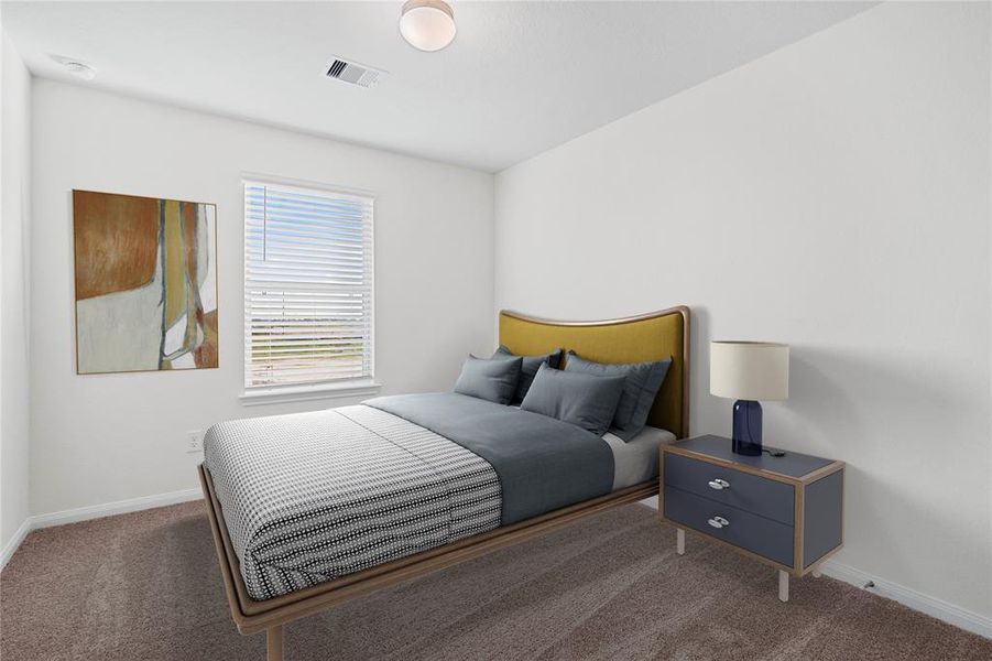 Secondary bedroom features plush carpet, neutral paint, lighting, window with privacy blinds and ample sized closet space.