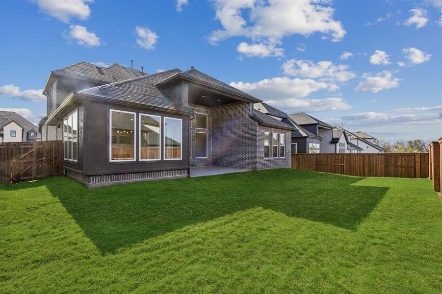 Exterior details and patio area of a home in Windsong Ranch 61' Series, Prosper (Image 2).