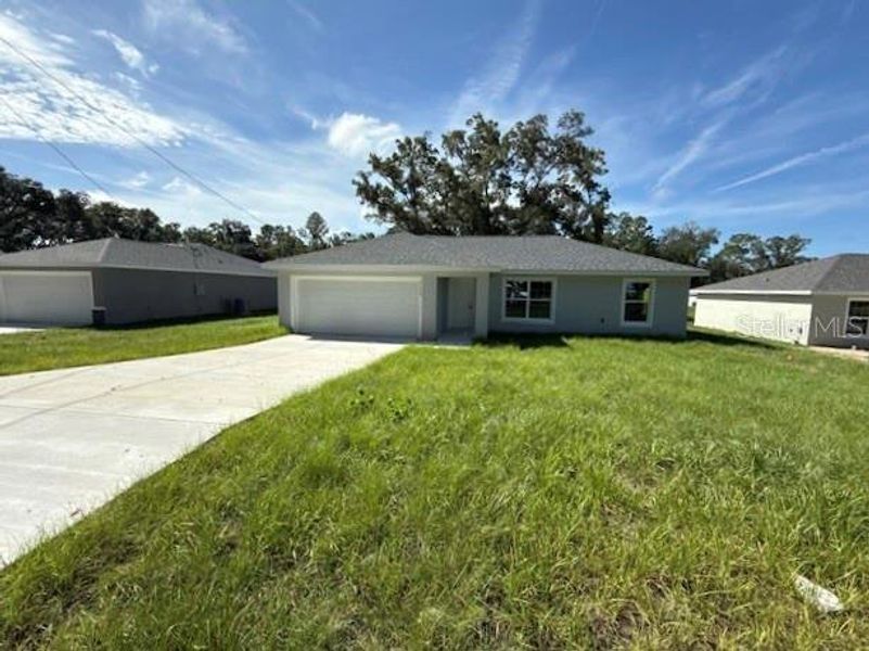 Front exterior of a new home in , Dunnellon, FL, highlighting curb appeal (Image 15). Front exterior of a new home in , Dunnellon, FL, highlighting curb appeal (Image 15).
