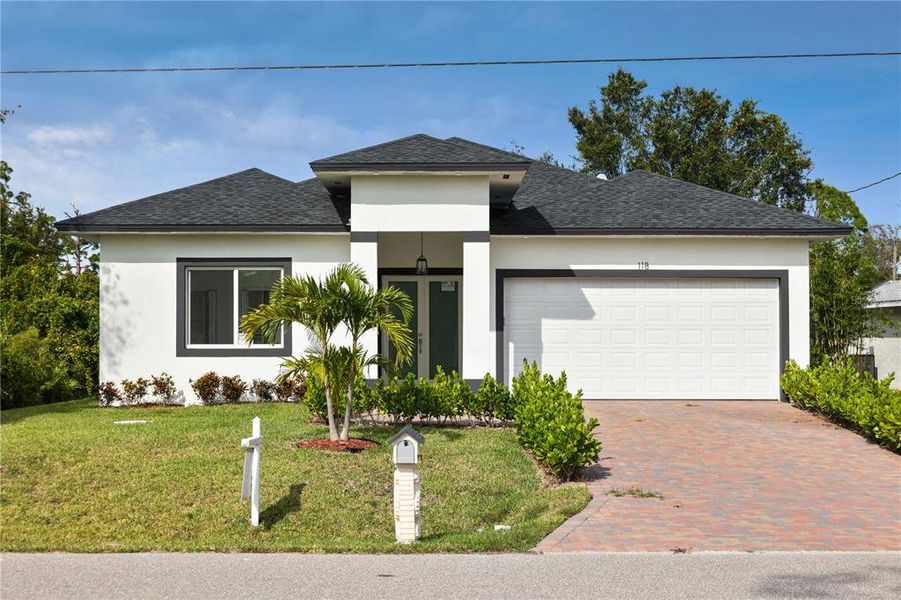 Front exterior of a new home in , Rotonda West, FL, highlighting curb appeal (Image 2).