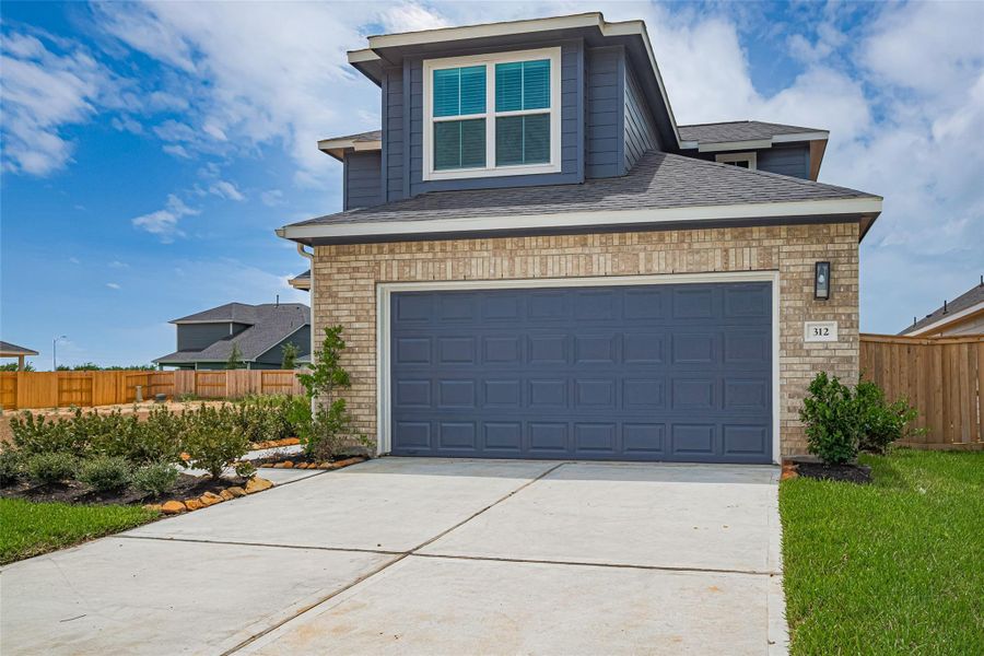 Front exterior of a new home in La Segarra, Brookshire, TX, highlighting curb appeal (Image 25).