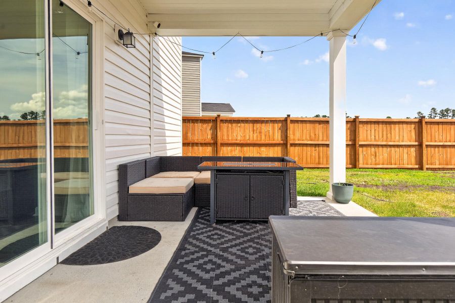 Exterior details and patio area of a home in Lindera Preserve at Cane Bay Plantation, Summerville (Image 31).
