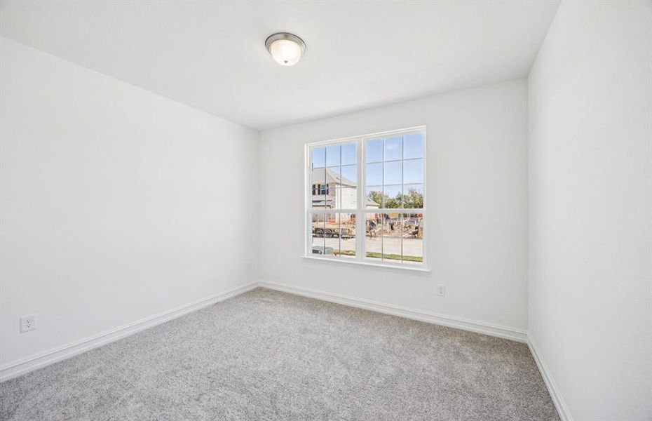 Comfortable bedroom with a bright window view Comfortable bedroom with a bright window view