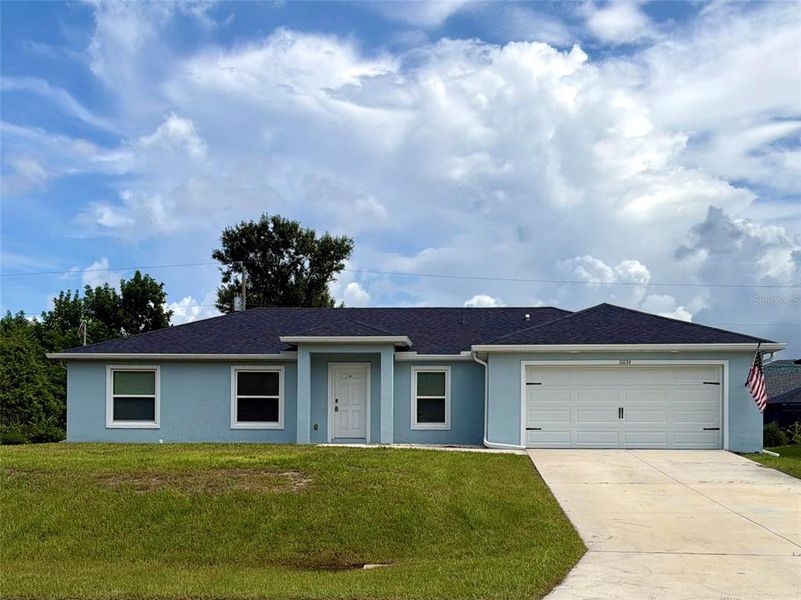 Front exterior of a new home in , Englewood, FL, highlighting curb appeal (Image 1). Front exterior of a new home in , Englewood, FL, highlighting curb appeal (Image 1).