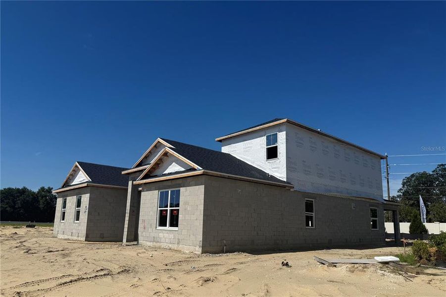 Front exterior of a new home in Willow Run, Apopka, FL, highlighting curb appeal (Image 2). Front exterior of a new home in Willow Run, Apopka, FL, highlighting curb appeal (Image 2).