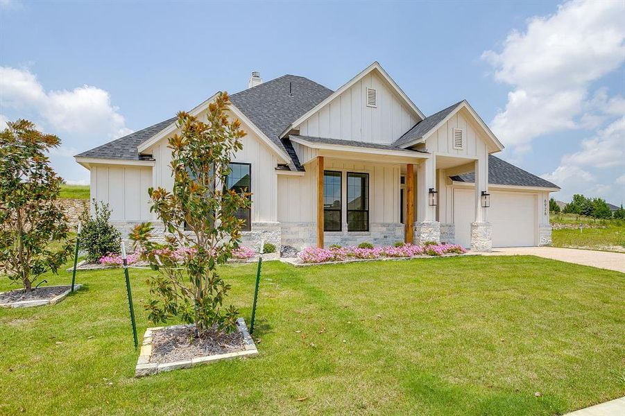 Front exterior of a new home in Whitestone Crest, Benbrook, TX, highlighting curb appeal (Image 25).
