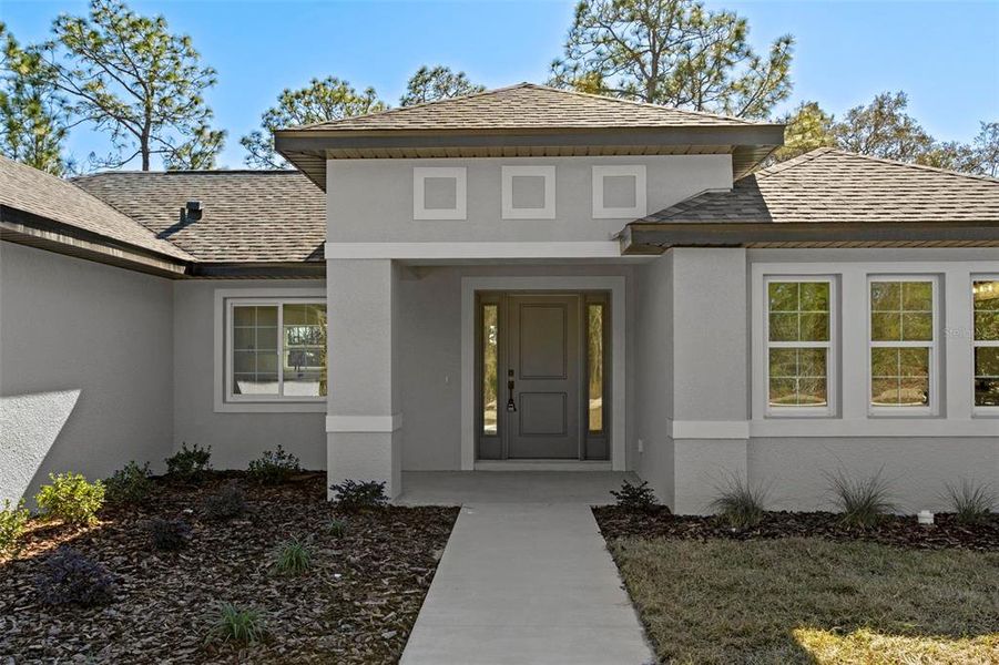 Front exterior of a new home in , Brooksville, FL, highlighting curb appeal (Image 20).