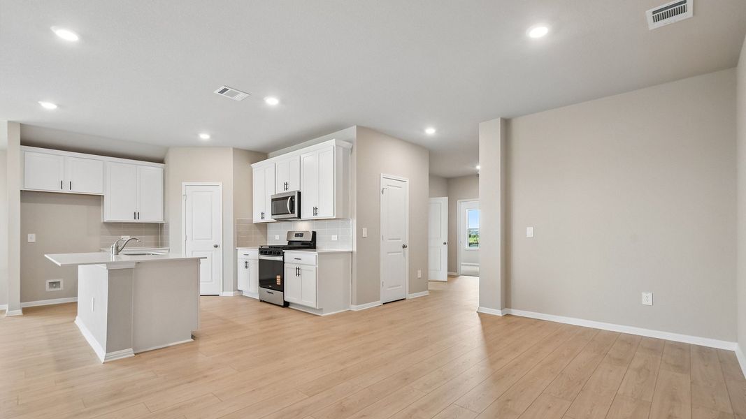 Furnished interior view inside a new home in Carillon, Manor (Image 11).