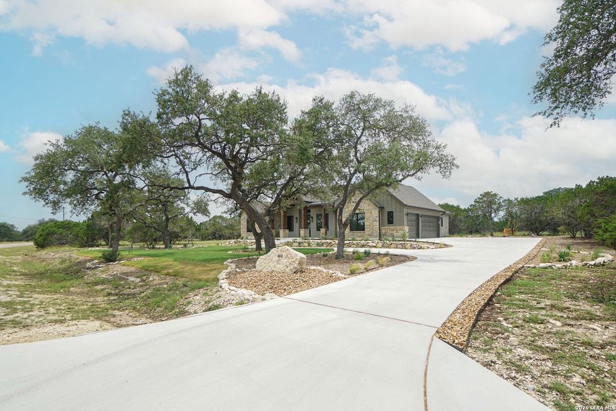 Front exterior of a new home in , Spring Branch, TX, highlighting curb appeal (Image 22). Front exterior of a new home in , Spring Branch, TX, highlighting curb appeal (Image 22).